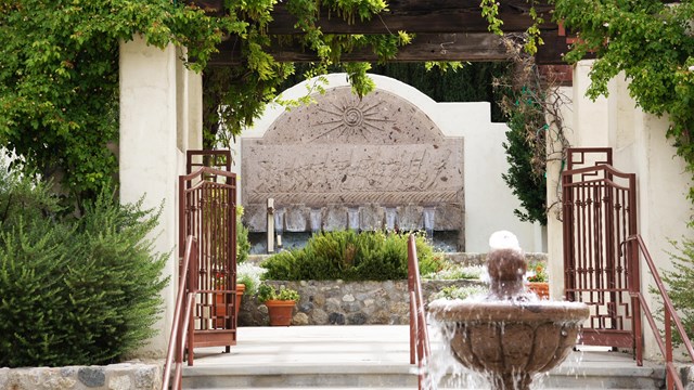 Spanish-colonial style plaza area with a fountain 