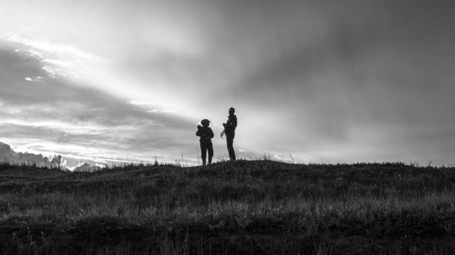 Two women standing in tundra