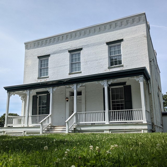 Two story white brick farmhouse