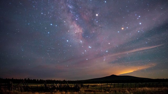 View of the night sky above Mount Dellenbaugh.