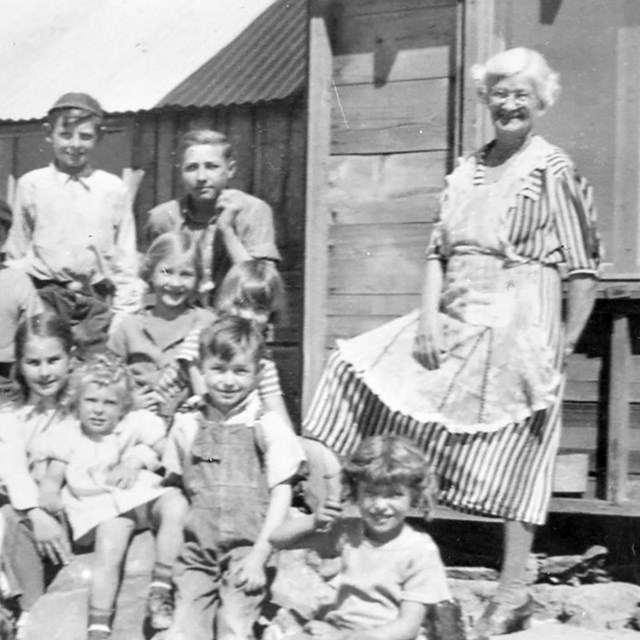 Schoolhouse teachers and children