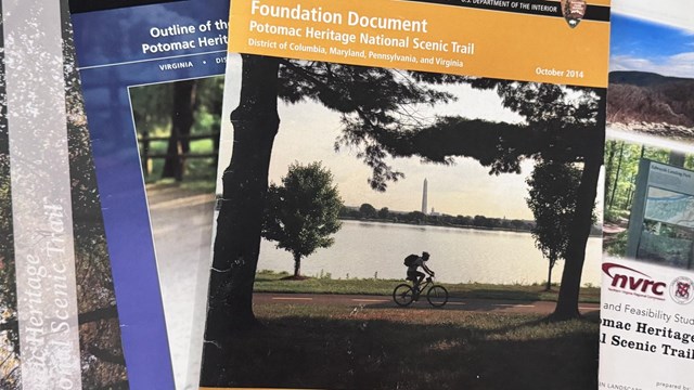 Four documents stacked on top of each other