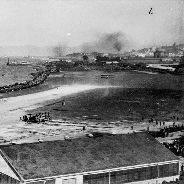 fisherman docking boats on shore of crissy airfield