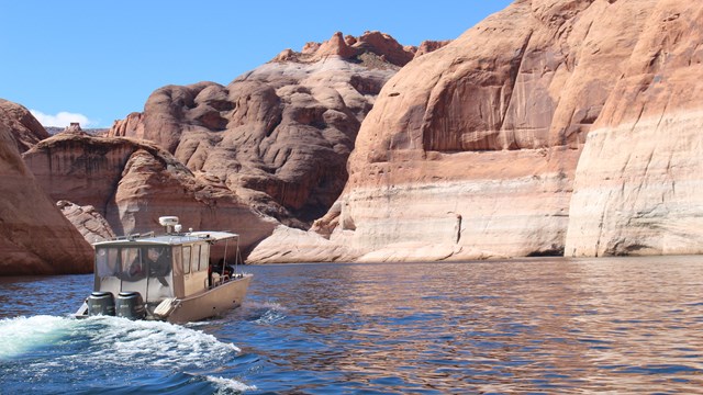 Boat motors through canyon