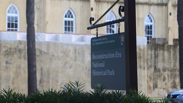 Sign in front of old building