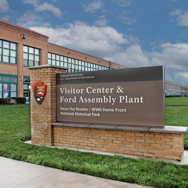 A brick sign says 