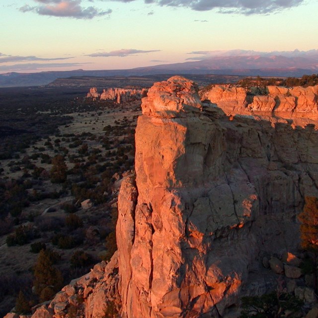 Rock formation lit up by sunset