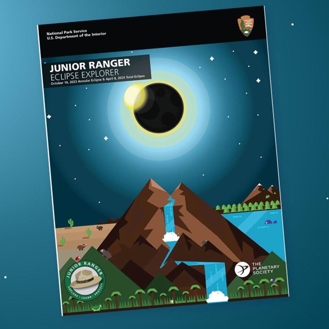 Eclipse Explorer booklet on a starry night background