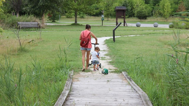 Visitors walking along boardwalk at North Point State Battlefield.