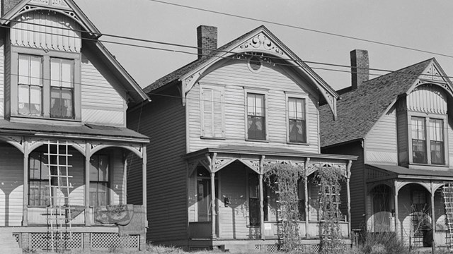 Two-story front gable houses, frame, front porches.