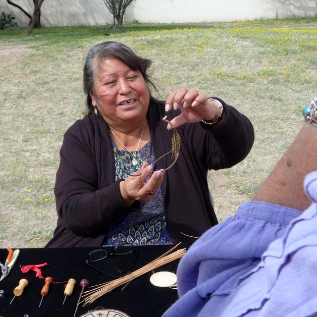 woman holding devil's claw