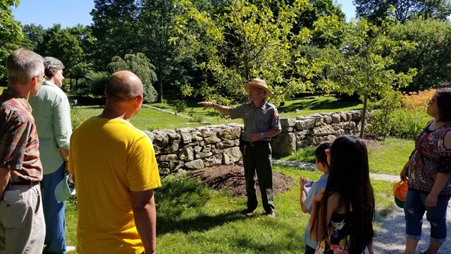 Park Ranger leads a tour outdoors at Weir Farm NHP. 