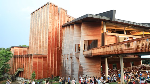 A (left) side view of the outside of the Filene Center