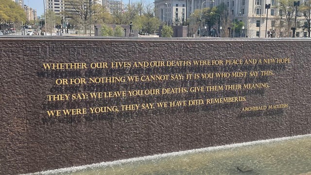 Cascading water behind a quote about World War I.