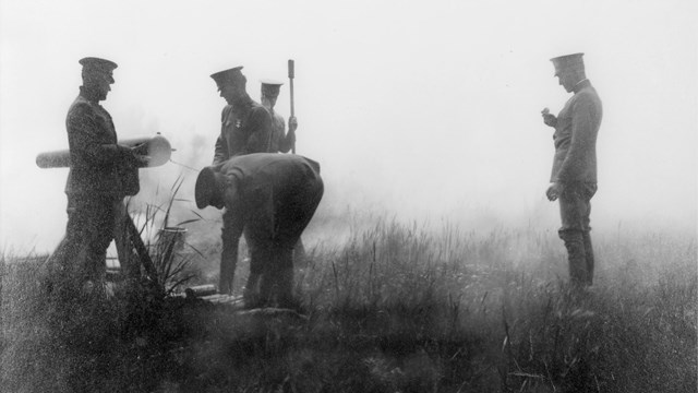 A historical photo of Calvary officers practicing with a canyon.