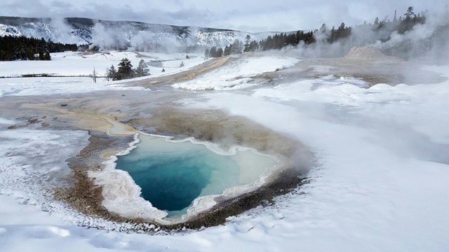A hot spring in the snow.