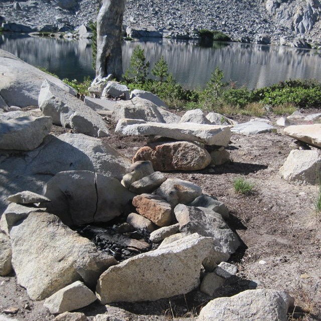 A campfire ring built too close to a body of water. 