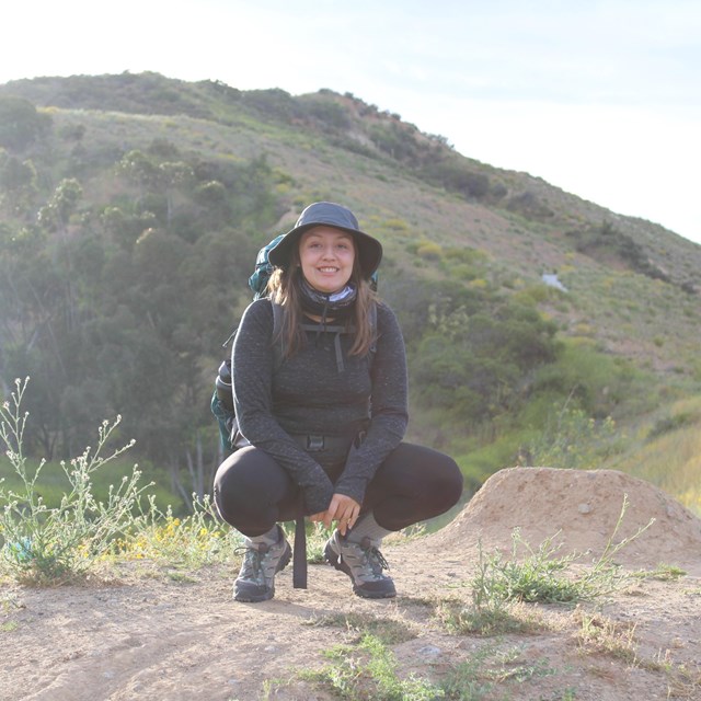 person kneeling outdoors