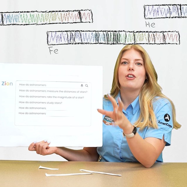 A scientist holds a poster board while drawings of light spectra float above her head.