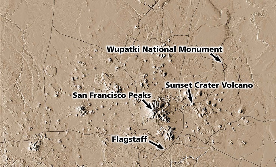 An aerial image of an area of the earth's surface showing several volcanic cones.