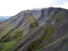 steep scree slope of a dark mountain
