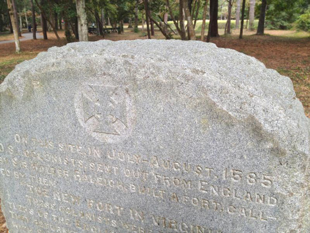 Present-day image of Virginia Dare marker with earthwork in background Present-day image of Virginia Dare marker with earthwork in background