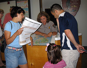 A teacher in the Teacher Ranger Teacher program works in Acadia National Park Visitor Center.