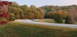 A curve along the Natchez Trace Parkway with fall colors