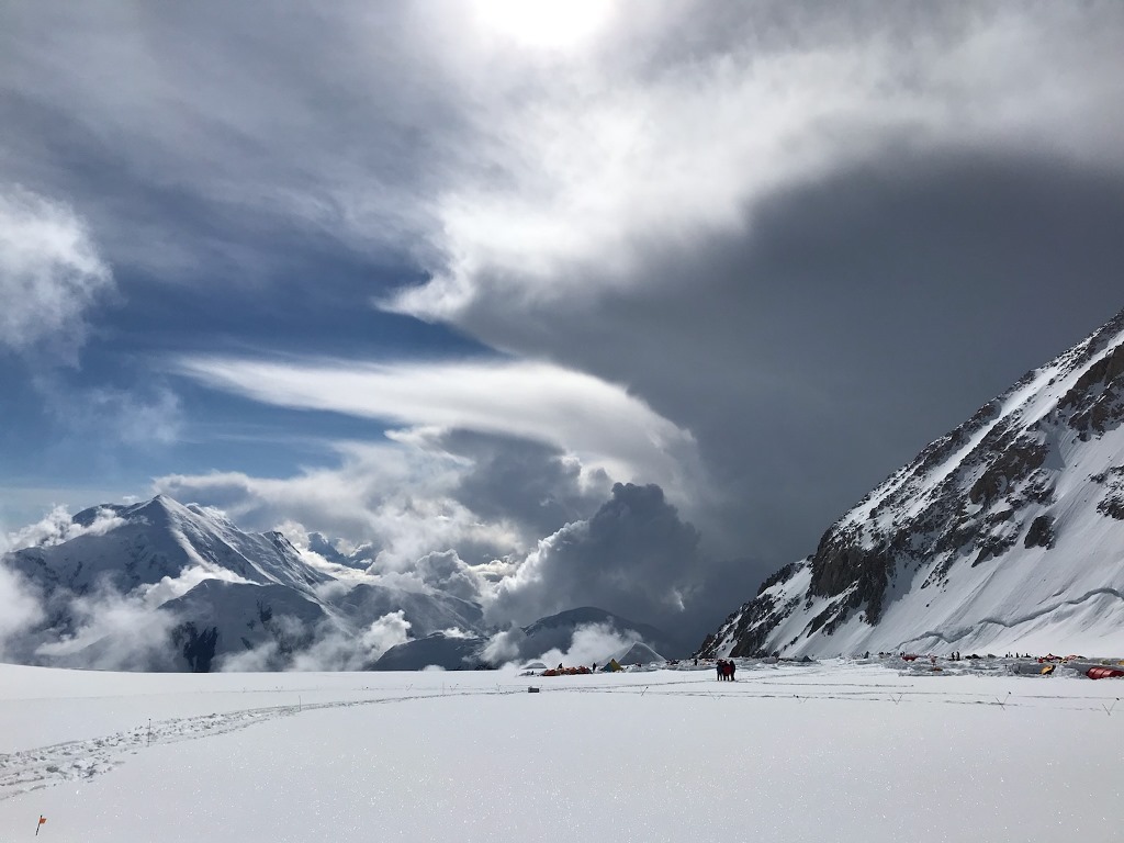 Dark brooding clouds envelope a mountain peak