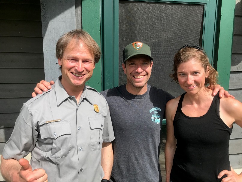 Three members of the BC patrol outside the ranger station