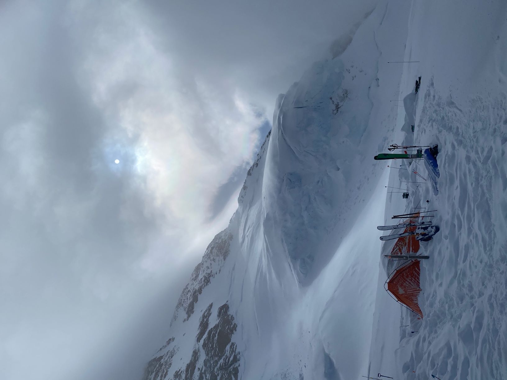 A dramatic sky over a tent at the 14,200 foot camp