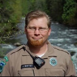 Park Ranger in front of river