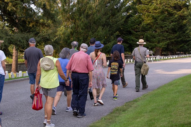 A ranger leads a guided walking tour of Gettysburg National Cemetery