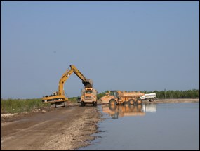 Hole-in-the-Donut restoration using heavy equipment