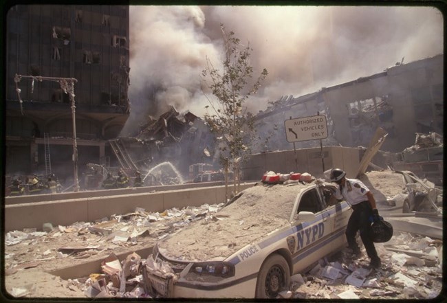 A NYPD car covered in dust and rubble of the World Trade Center