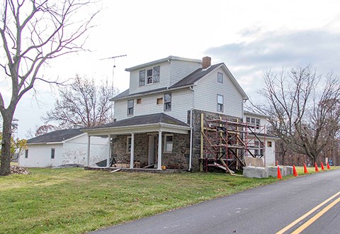 National Park Service preservationists are at work restoring the James Warfield home. Restoration work will include re-establishing the original roofline and roof height, reconstructing sections of masonry walls, and recreating windows and doors.