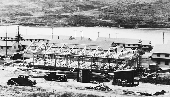 a wood frame barracks under construction