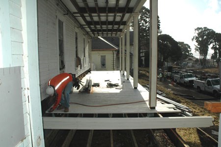 carpenters installing floor decking on Fort Baker porch