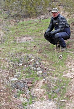 Examining a check dam built in the 1990's.