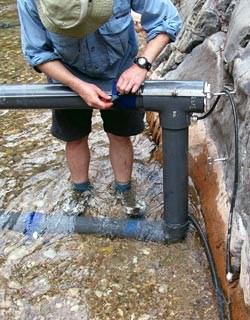 Installing a PIT tag antenna in Shinumo Creek.