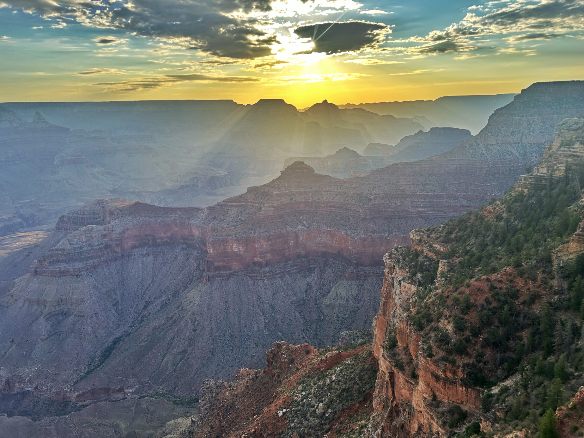 Yavapai View from 8-20-25 Sunrise with clouds and a canyon landscape