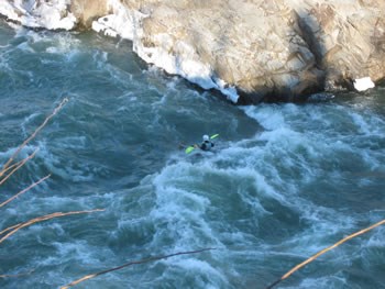 Kayaker surfing in standing waves