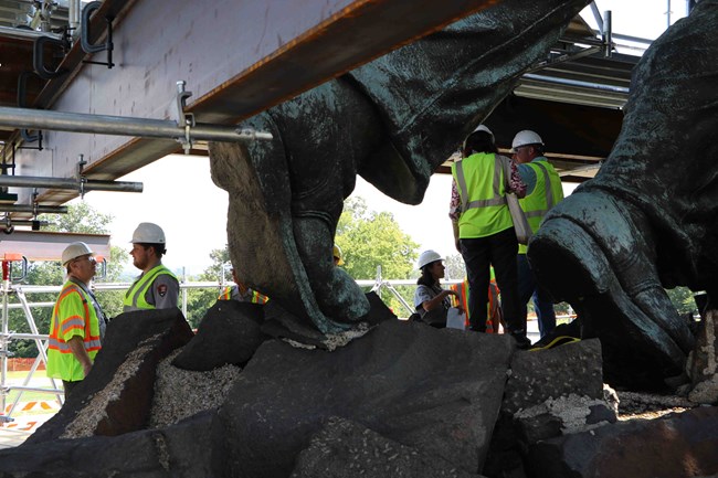 Staff inspecting the memorial.