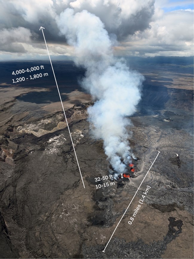 An aerial photograph of a crater filled with molten lava.