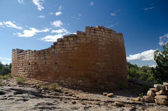 a wide, curved stone dwelling