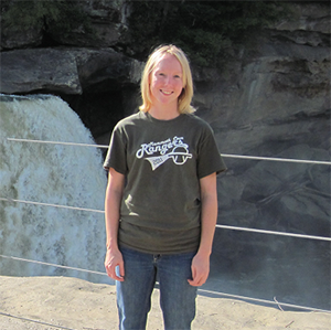 Clare Clare Bledsoe standing in front of waterfal