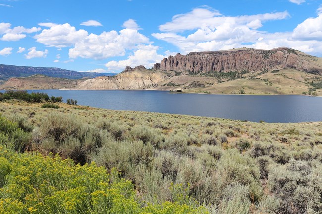 Blue Mesa Reservoir NPS Blue Mesa Reservoir and Dillon Pinnacles viewed from sagebrush-covered southern shore.