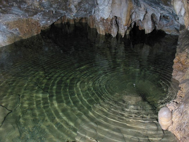 Cave water with rings from dripping