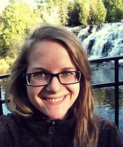 Woman in front of waterfall