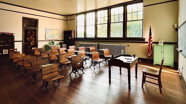 Classroom filled with rows of old desks at Plains High School.